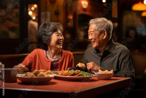 Happy Asian elderly man and woman or family having dinner in restaurant, romance