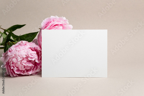 Blank paper greeting or invitation card mockup with flowers, copy space for card design