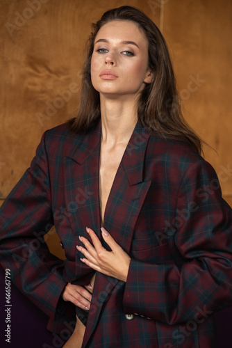 Stylish sexy woman in jacket posing 