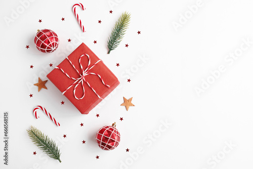 Christmas gift with decorations on white background
