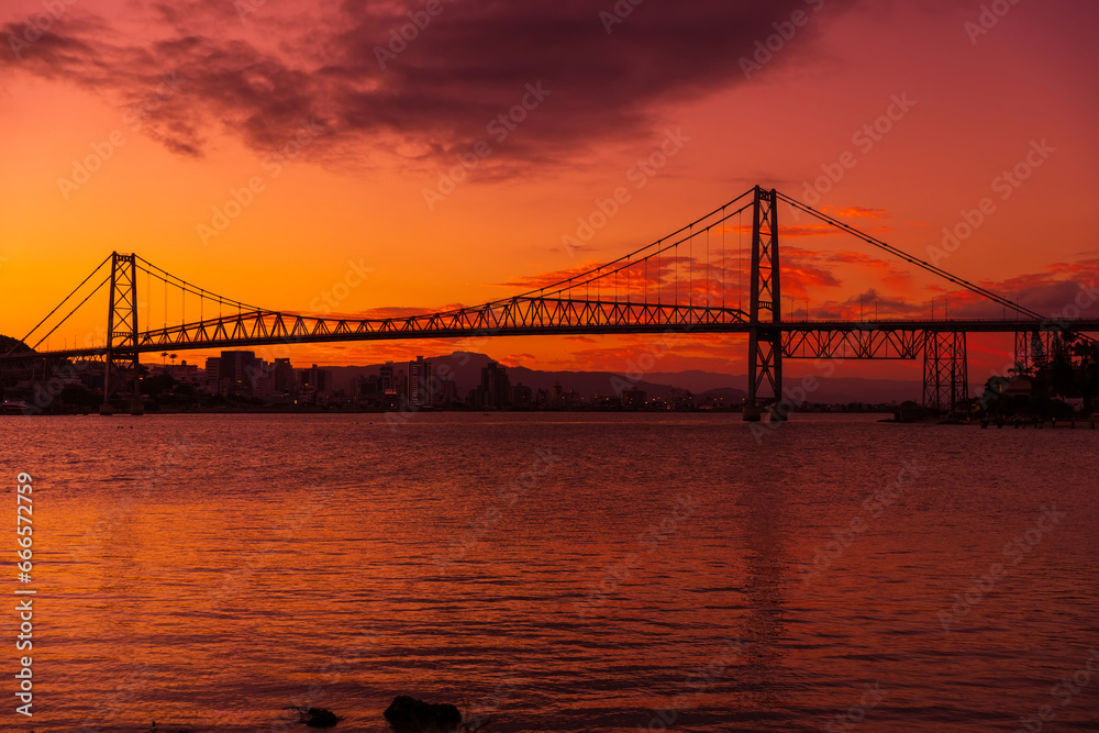 Fototapeta premium Hercilio luz cable stayed bridge and sunset with bright sky in Florianopolis