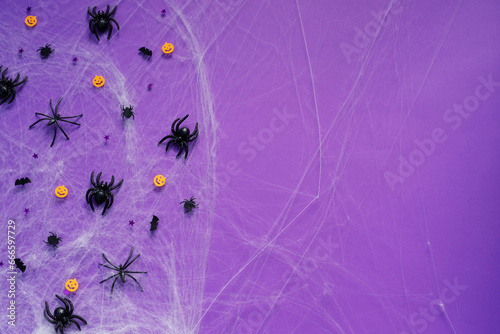 Happy Halloween banner mockup  pumpkins  bats and spiders on purple background