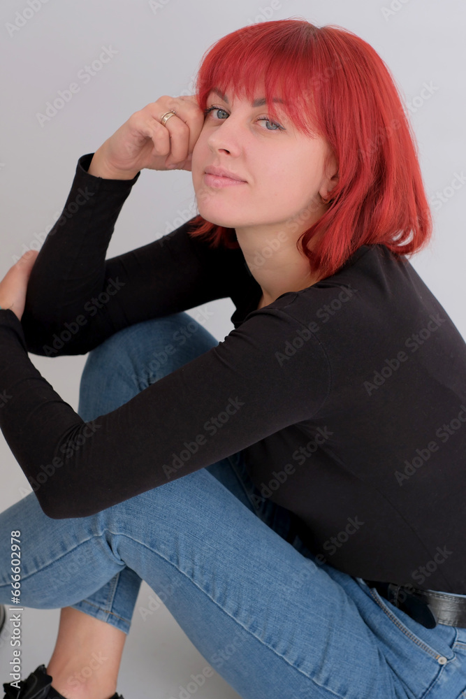 Beautiful cute young woman with orange hairstyle