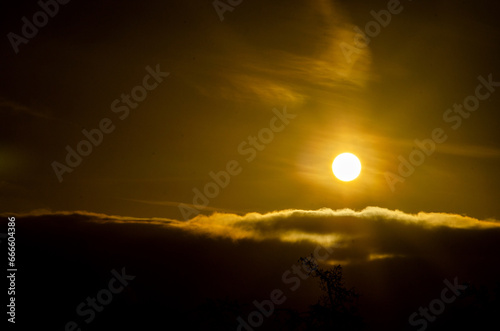 Fototapeta Naklejka Na Ścianę i Meble -  Sunrise against the background of sky and clouds