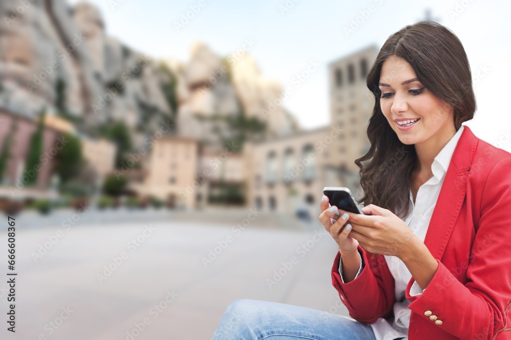 Portrait of a confident young business woman hold smartphone Portrait of a confident young business woman hold smartphone