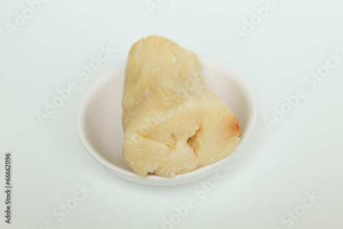 Tapai is fermentation of cassava with yeast. Indonesian snack. Isolated on white background