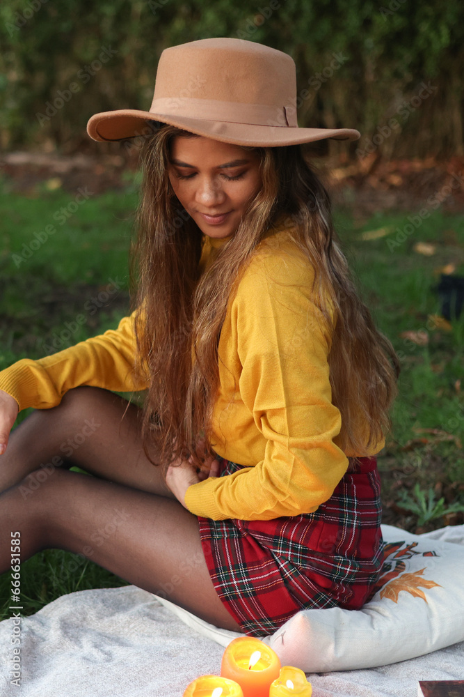 Beautiful girl autumn-style picnic