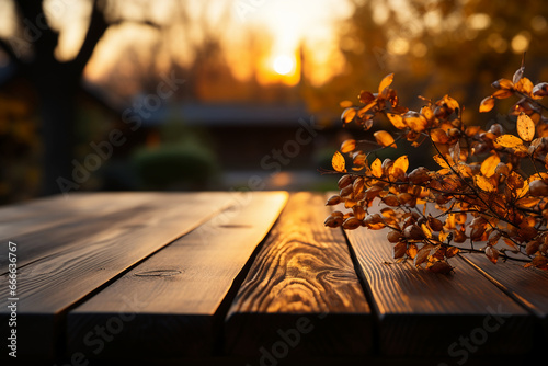 A wood table  tabletop product display with a golden autumn sunset sky and leaf background for seasona. AI generative