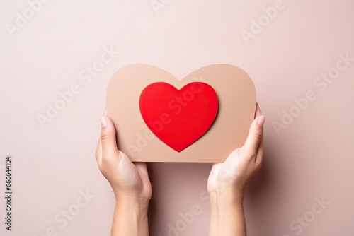 Family concept. Hand holding red heart isolated on a white background. Copy space