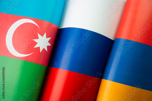 Background of the flags of the azerbaijan, russia, armenia. concept of interaction or counteraction between the countries. International relations. Collective Security Treaty Organization