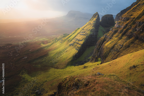 Golden ethereal sunrise or sunset light over beautiful, idyllic mountain landscape of Dun Dubh at the Quiraing on the Isle of Skye, Scottish Highlands, Scotland. © Stephen