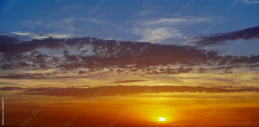 sunset sky with clouds and sun   