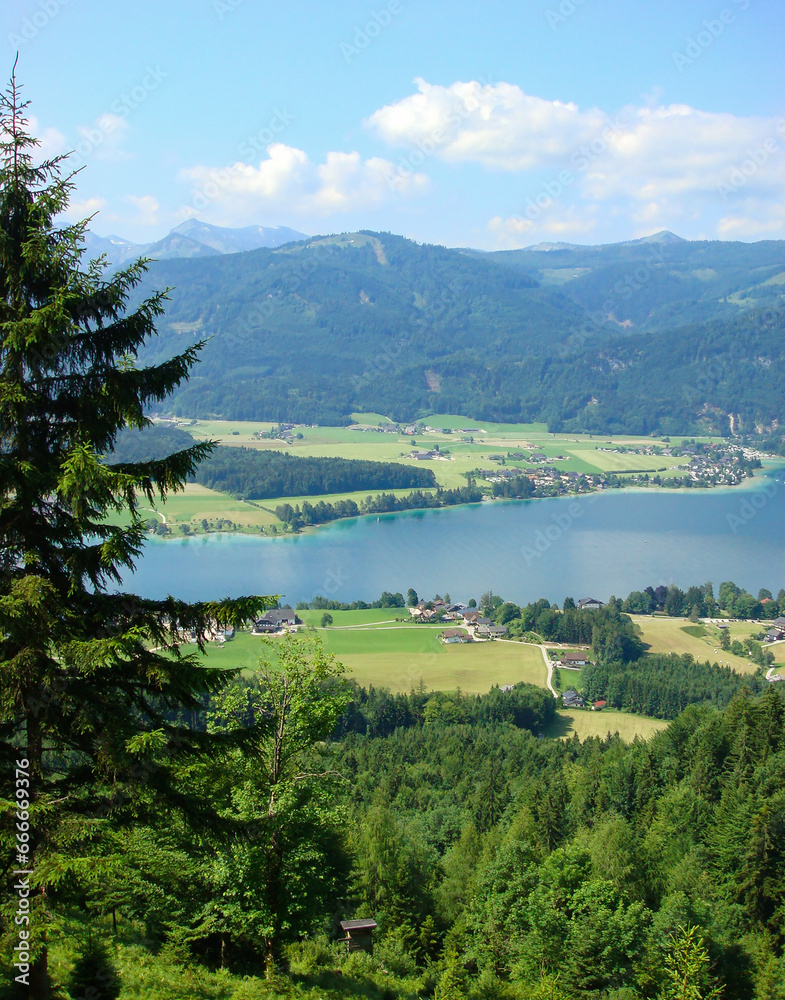 Panoramic view of the mountains and lake on the sunny day. Austria.