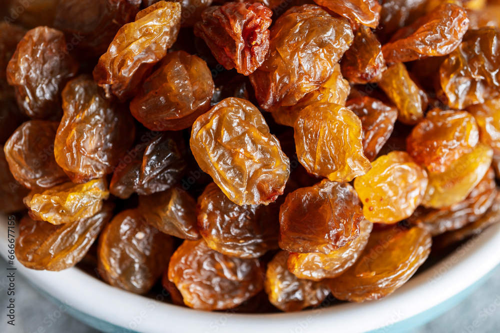 Close up of dark raisins - dried grapes, vegetarian nutrition, healthy food, nutrition for heart muscle Close up of dark raisins - dried grapes, vegetarian nutrition, healthy food, nutrition for heart muscle