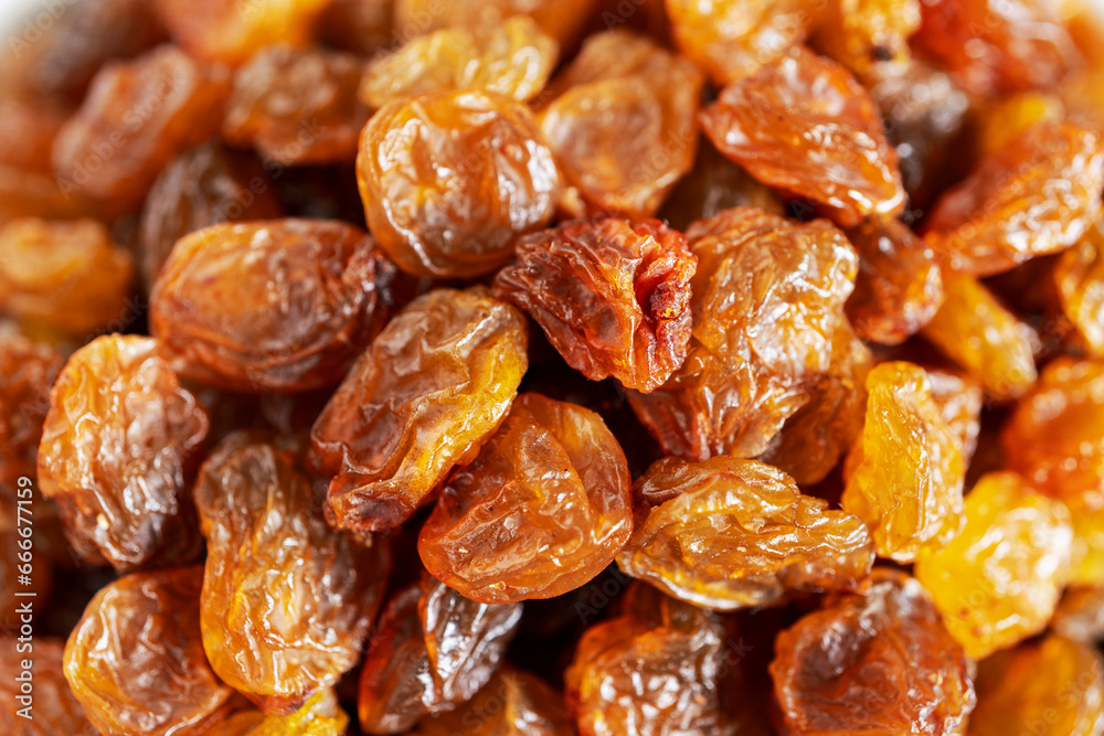 Close up of dark raisins - dried grapes, vegetarian nutrition, healthy food, nutrition for heart muscle