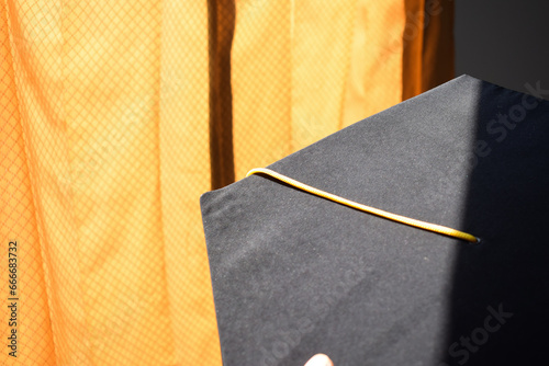 Close-up Black Graduation Hat and Yellow Tassel  © ahmadfaiz