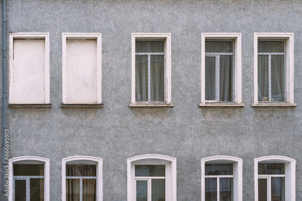 White double PVC windows. Gray wall.