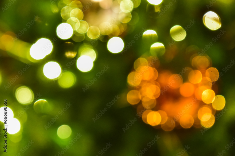 The bokeh effect of the Christmas tree. Colorful lighting. Festival celebration concept.