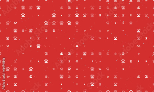 Seamless background pattern of evenly spaced white pet symbols of different sizes and opacity. Vector illustration on red background with stars
