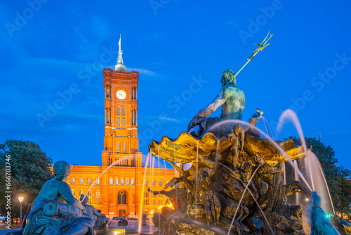 View of Rotes Rathaus (Town Hall) and Neptunbrunnen fountain at dusk, Panoramastrasse, Berlin, Germany photo