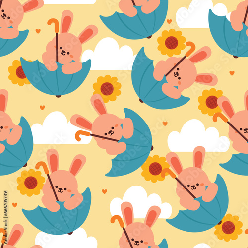 seamless pattern cartoon bunny playing with umbrella. cute animal wallpaper with sky element, umbrella © PIPIOREN