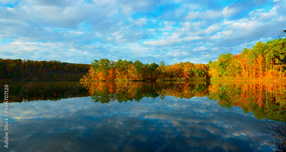 Amazing scenery of autumn forest reflected in the lake