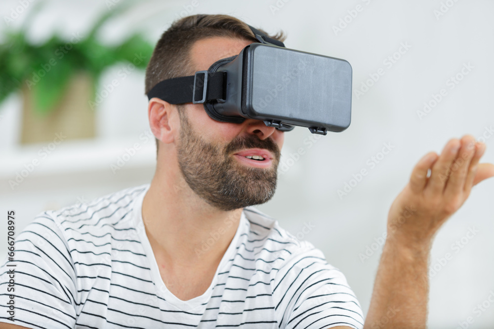 man using virtual reality googles man using virtual reality googles