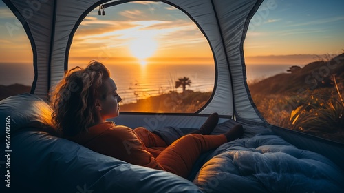 A woman is observing nature from geo dome tents with a green blue and orange background. This is a cozy camping, glamping, holiday vacation, lifestyle concept, outdoor cabin, and scenic