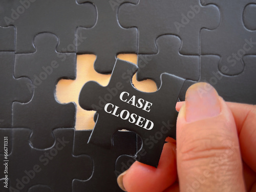Social issues, law and justice concept. CASE CLOSED written on puzzle set. With blurred styled background. photo