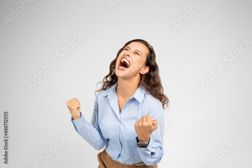 Fotografie Angry, unhappy, despaired, depressed young european woman in formal wear screams