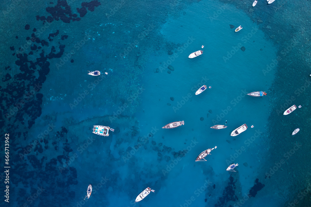 Aerial view of boats anchored in the crystal blue waters, Palmarola island, Tyrrhenian Sea, Ponza municipality, Pontine archipelago, Latina Province, Latium (Lazio) Aerial view of boats anchored in the crystal blue waters, Palmarola island, Tyrrhenian Sea, Ponza municipality, Pontine archipelago, Latina Province, Latium (Lazio)