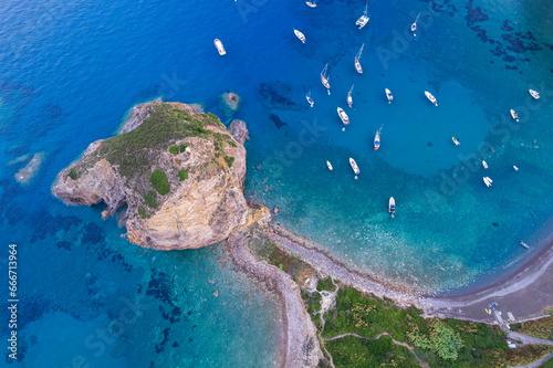 Aerial view of the cliff of Saint Silverio with boats anchored in Francese Bay, Palmarola island, Ponza municipality, Tyrrhenian Sea, Pontine archipelago, Latina Province, Latium (Lazio) photo