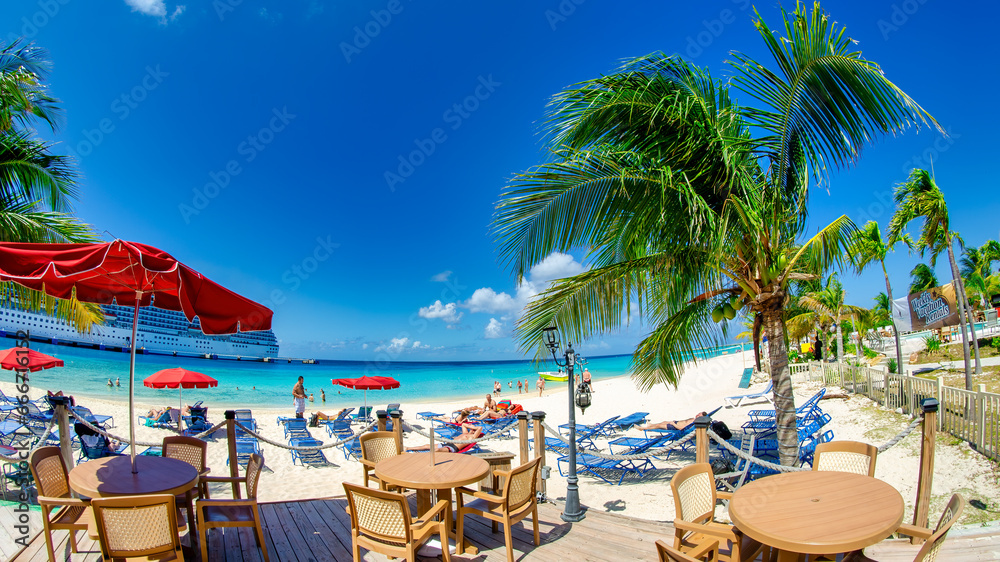 Turks and Caicos - February 22, 2012: A beautiful caribbean beach with tourists