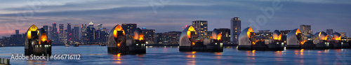 Thames Barrier dusk panorama with Canary Wharf beyond, London, England photo