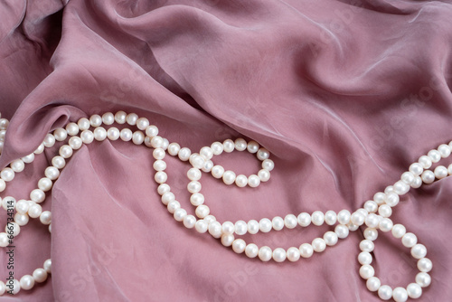 silk and pearls background styled stock scene, for wedding invitation, product showcase or styled presentation with copy space, top view