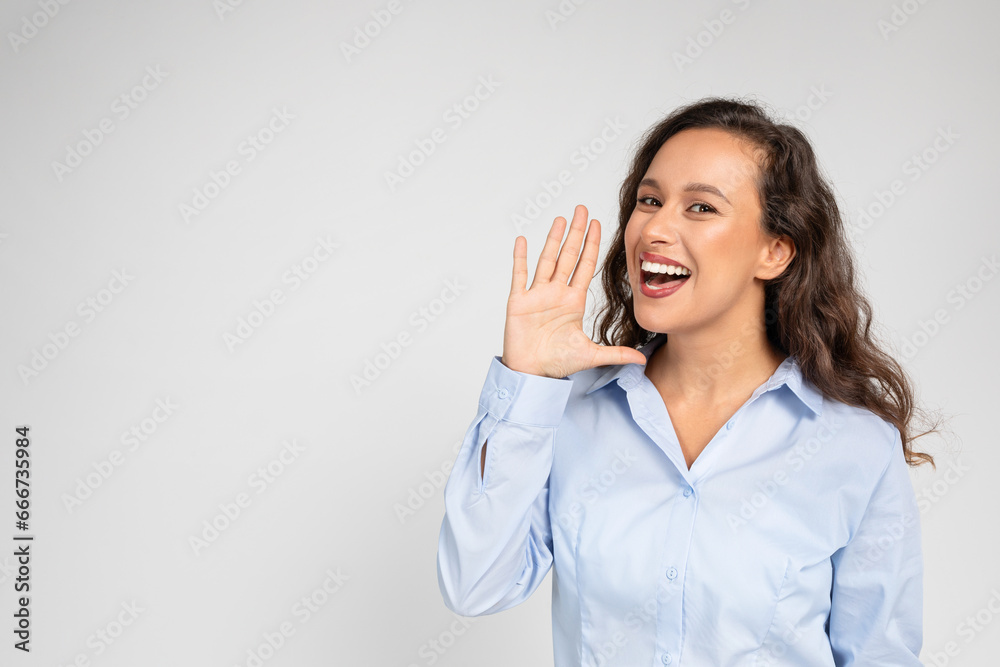 Young European woman screams, hand over mouth Young European woman screams, hand over mouth