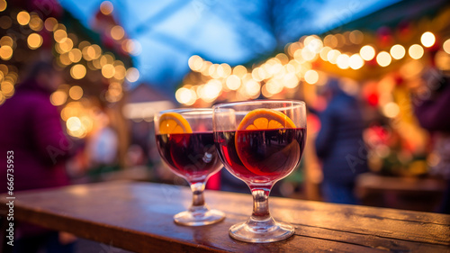 a glass of mulled wine on the background of the christmas tree