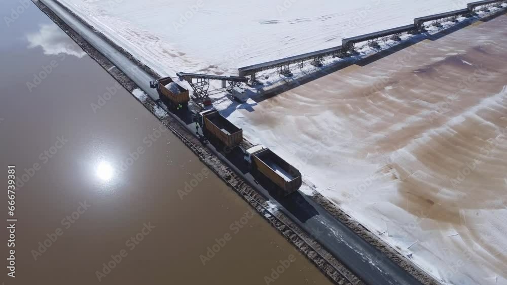 Aerial drone view of Salt production in the evaporators of sea salt in nature reserve Marismas del Odiel. Traditional Sea salt production produced by the evaporation of seawater. Aerial drone view of Salt production in the evaporators of sea salt in nature reserve Marismas del Odiel. Traditional Sea salt production produced by the evaporation of seawater.