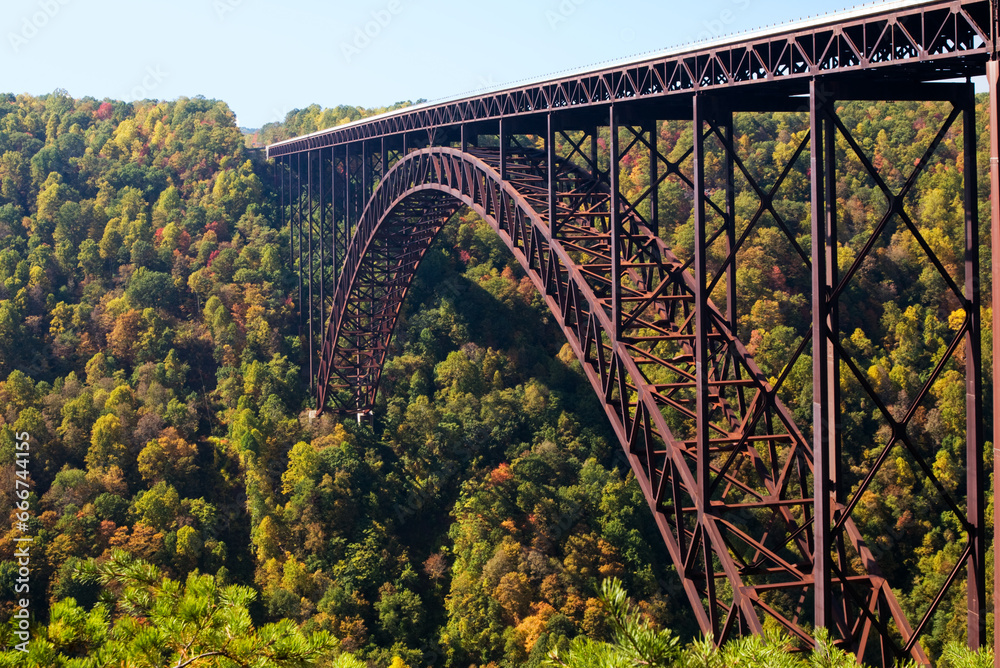 A telephoto view of the New River Gorge Bridge, a single-span deck arch bridge, national landmark and engineering marvel in West Virginia. 