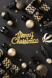 Merry Christmas greeting card poster with luxury gold and black decorations, elegant gift boxes, baubles, confetti on black background.