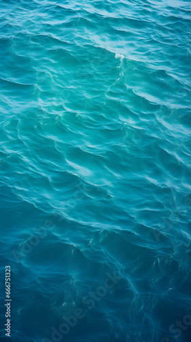 Deep blue waves, mesmerizing ocean patterns, sunlight reflections, soothing marine backdrop, nature's elegance.