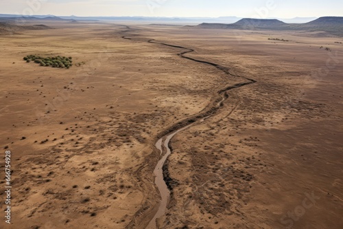 winding road in the desert during drought. Dry land aerial view. Environmental issues.