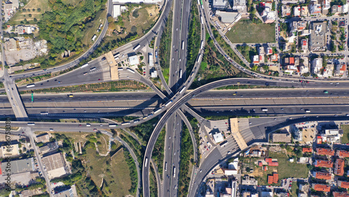 Aerial drone photo taken from high altitude of multilevel junction national road crossing urban Metropolitan area