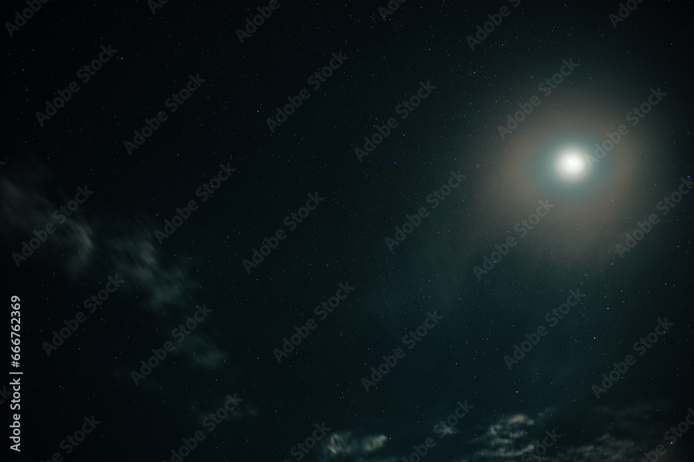 Moon shine on night sky with stars and clouds