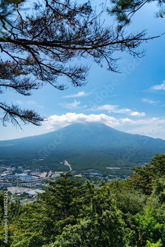 Mount Fuji in Summer clear sky with clouds at the peak