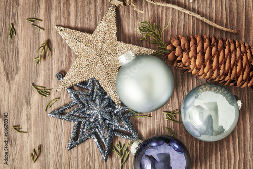 Festive Christmas stars, baubles, snowflakes and other decorative toys on the desk. New Year theme backgrounds