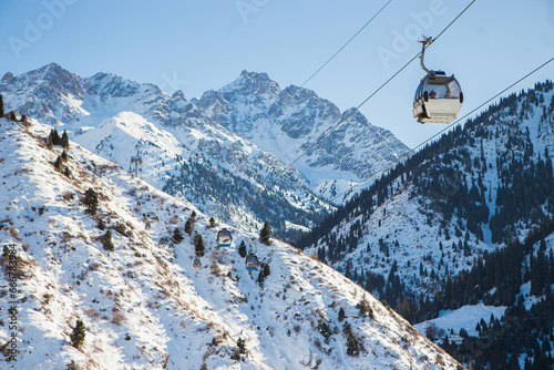 Cableway with funicular in the winter mountains at Shymbulak mountain resort in Almaty, Kazakhstan.