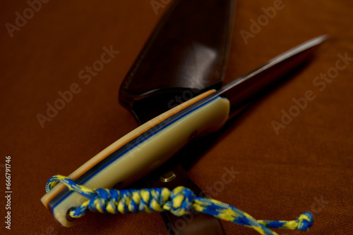 Fotografie Handmade hunting knife in a leather sheath