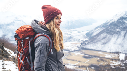 woman wearing rucksack hiking in winter