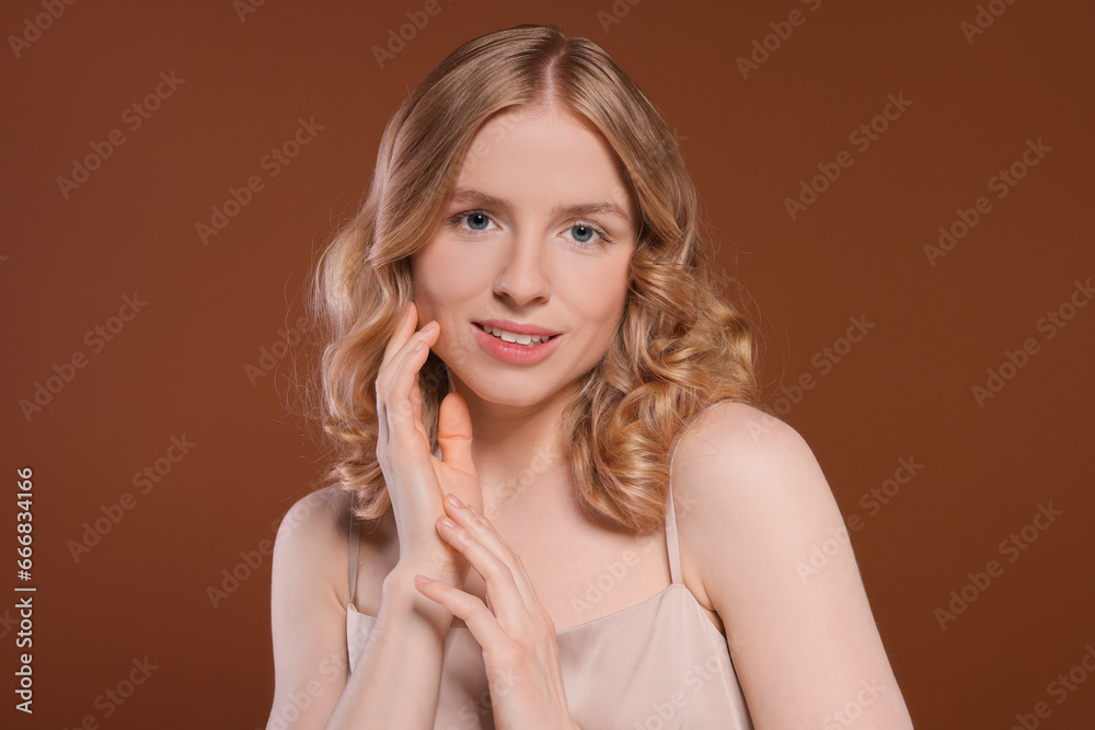 Portrait of beautiful woman with blonde hair on brown background Portrait of beautiful woman with blonde hair on brown background
